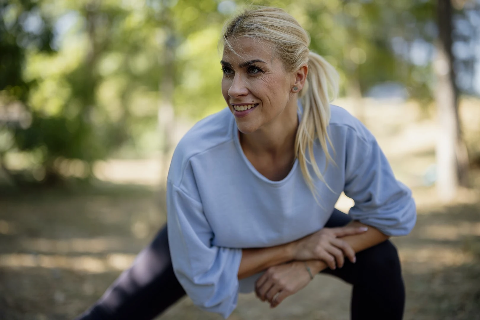 Person stretching outdoors in a park